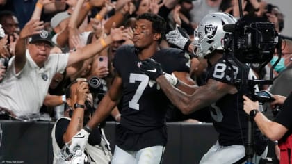 Las Vegas Raiders' Foster Moreau (87), Marcus Mariota (8) and Derek Carr  (4) celebrate a touchd …