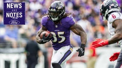 Baltimore Ravens running back Gus Edwards runs with the ball