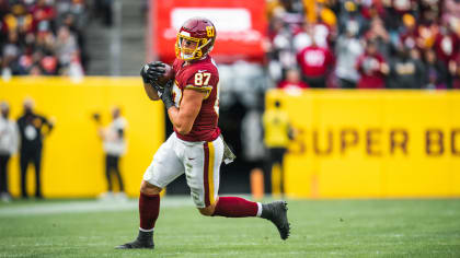 Washington Commanders tight end John Bates (87) runs during an NFL