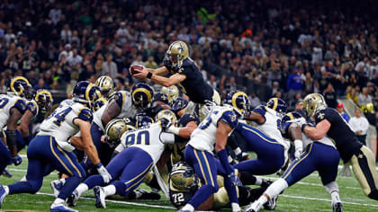 Workers removing Rams banners from the Edward Jones Dome