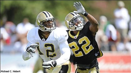 New Orleans Saints Scott Shanle jumps on Marques Colston after