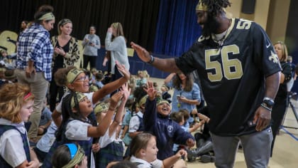 Saints' Demario Davis surprises students with 'Child of God' headbands