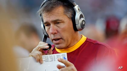 Washington Redskins head coach Jim Zorn, left, talks on the