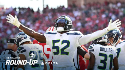 Seattle Seahawks defensive end Darrell Taylor (52) and defensive end L.J.  Collier celebrate during the first half of an NFL football game against the  Los Angeles Rams, Thursday, Oct. 7, 2021, in