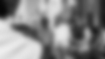 Claypool poses with his stylist Joe Kuma (left) and creative director Michael Gonzales (right)