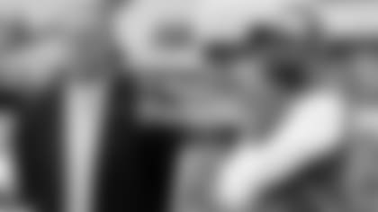 Jeff Ireland and Brian Flores