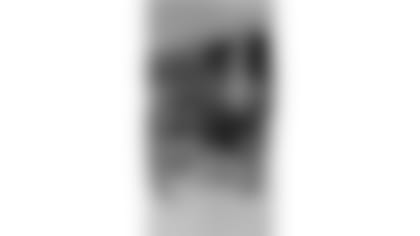 Tyrique Stevenson poses for a picture with his four sisters.