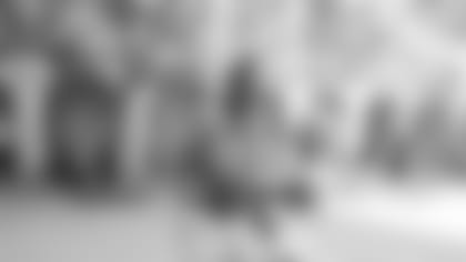 Claypool hugs designer Feng Chen Wang following her fashion show.