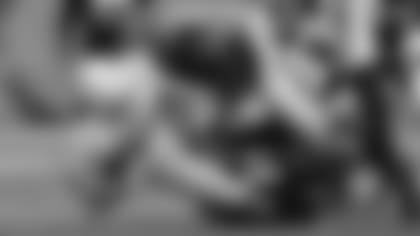 Cam Sample (top) and Vonn Bell rallied the Bengals defense with one of four sacks against Justin Herbert.