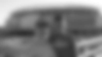 Young Sam Hubbard heads to a pre-season game with grandfather Ken Schneider.