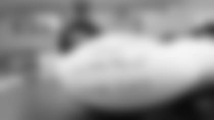 Head Coach Zac Taylor signs game balls to be delivered to Bengals bars on Sunday, January 15 2023 after the Bengals beat the Ravens in Wild Card Weekend.