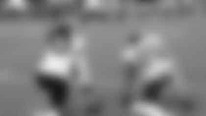 Dre Kirkpatrick (left), now the senior DB, chats with fellow cornerback KeiVarae Russell during a camp practice.