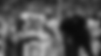 Zac Taylor greets one of his DBs who dominated last Sunday, free safety Jessie Bates III.