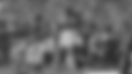 Defensive linemen Michael Johnson and Carlos Dunlap celebrate a touchdown against the Miami Dolphins. Johnson scored on a pick six in the fourth quarter.