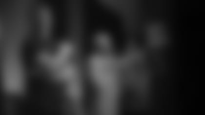 Andy Dalton, Ken Anderson, Dave Lapham, left to right, make it an action auction.