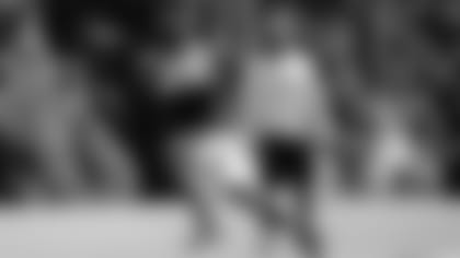 WR Ja'Marr Chase catches the ball in front of WR coach Troy Walters during training camp at the Kettering Health Practice Fields on Sunday, August 13, 2023.