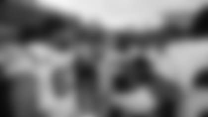 Evan McPherson (center) celebrates with his team after winning the 2021 season AFC Championship in Kansas City, MO.