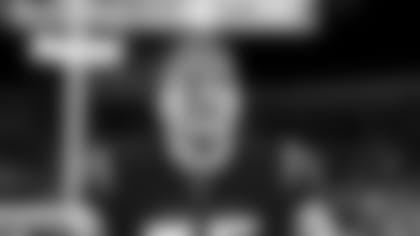 2020 Bengals Draft Pick LB Logan Wilson warms up before the Ravens-Bengals 2022 season Wild Card game at Paycor Stadium.