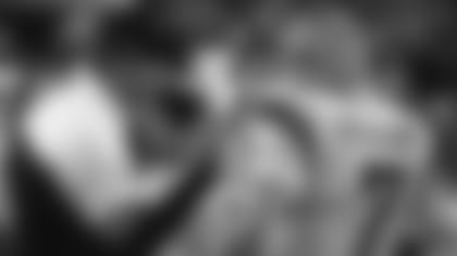 Head coach Sam Wyche talks with Boomer Esiason on the sideline during Super Bowl XXIII.
AP Images / Al Messerschmidt