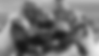 Tennessee Titans' Derrick Henry (22) is tackled by Cincinnati Bengals' Christian Covington (99) and Vonn Bell (24) during the first half of an NFL football game, Sunday, Nov. 1, 2020, in Cincinnati. (AP Photo/Jay LaPrete)