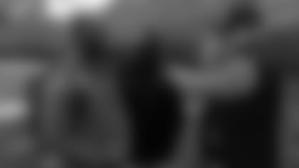 Bengals president Mike Brown (right) greets Kentucky safety Mike Edwards as Ray Oliver looks on.