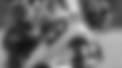 Linebacker Germaine Pratt looks to stop NFL leading rusher Derrick Henry.