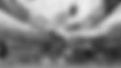 C.J. Uzomah warming up his injured knee before Super Bowl LVI.