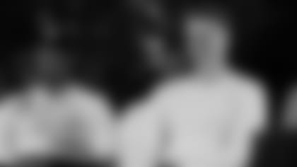 Ja'Marr Chase (left) and Joe Burrow watch their name called Thursday night.