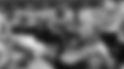 Running back Trayveon Williams averaged 4.9 yards per carry in his 2021 debut.