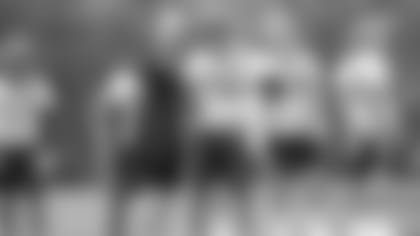 Zac Taylor coaches up wide receiver Cody Core Tuesday.