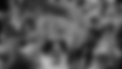 LSU quarterback Joe Burrow holds the trophy as safety Grant Delpit looks on after a NCAA College Football Playoff national championship game against Clemson, Monday, Jan. 13, 2020, in New Orleans. LSU won 42-25. (AP Photo/Sue Ogrocki)