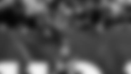 Cincinnati Bengals tight end C.J. Uzomah (87) takes a photo with fans after a 41-21 win over the Baltimore Ravens after an NFL football game, Sunday, Dec. 26, 2021, in Cincinnati. (AP Photo/Emilee Chinn)