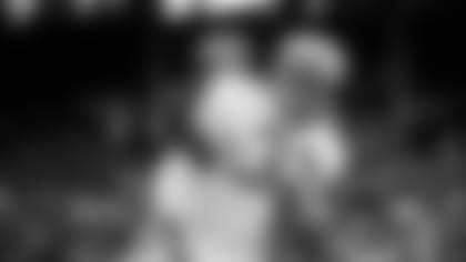 FILE - Jimmy Brown (32), running back for the Cleveland Browns, is shown in action against the New York Giants in Cleveland, Ohio, on Nov. 14, 1965. NFL legend, actor and social activist Jim Brown passed away peacefully in his Los Angeles home on Thursday night, May 18, 2023, with his wife, Monique, by his side, according to a spokeswoman for Brown's family. He was 87. (AP Photo/File)