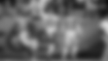 Cincinnati Bengals wide receiver Tyler Boyd (83) runs in a touchdown as Denver Broncos free safety Justin Simmons (31) and cornerback Pat Surtain II (2) pursue during the second half of an NFL football game, Sunday, Dec. 19, 2021, in Denver. (AP Photo/David Zalubowski)