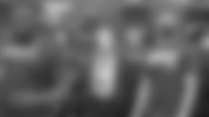 Mike Brown, flanked by Trey Hopkins and Joe Burrow at Saturday's visit to the Freedom Center.