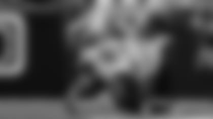 Cam Sample gets a hit on the QB.