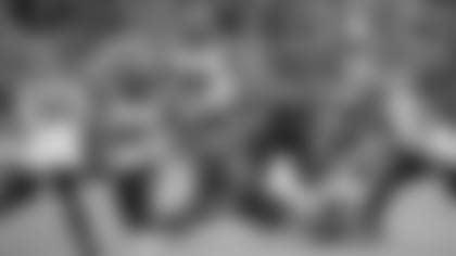 Baltimore Ravens quarterback Lamar Jackson, bottom, dives forward during a run as a host of Cincinnati Bengals defenders try to get to him during the second half of a NFL football game Sunday, Oct. 13, 2019, in Baltimore. (AP Photo/Nick Wass)