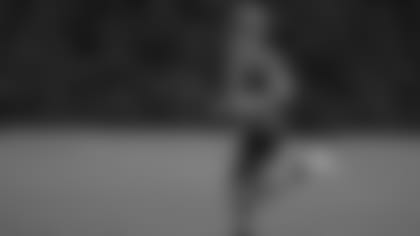 Joe Burrow jogs into camp.