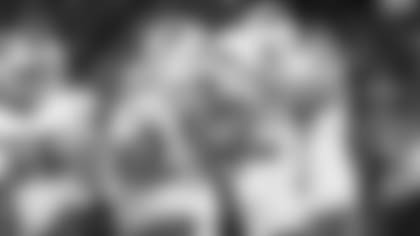 A.J. McCarron celebrates his touchdown run with Logan Thomas and others in Chicago.