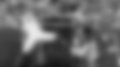 Wide receiver Zay Jones makes a diving catch with Tre'Davious White looking on.