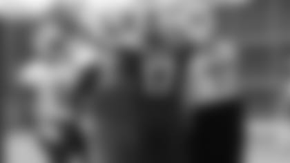 Quarterback Josh Allen congratulates members of the offseason after making a big play in an OTA practice this spring.