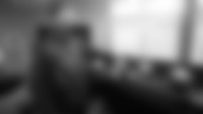 Russ Trainor gestures toward the line of monitors set up at Vic Fangio's house.