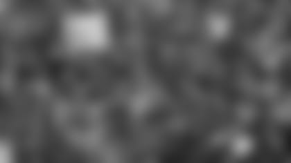 Former Cleveland Browns' Joe Thomas leads the fans in a cheer in the first half during an NFL football game against the Los Angeles Chargers, Sunday, Oct. 14, 2018, in Cleveland. (AP Photo/David Richard)