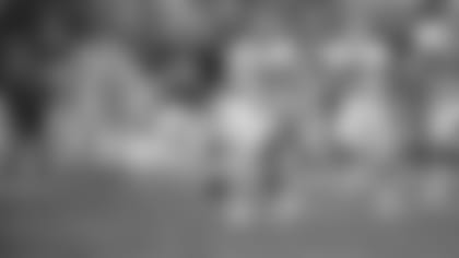 Cleveland Browns running back Eric Metcalf (21) runs away from Buffalo Bills Mickey Sutton (20) for a 90 yard kickoff return in the third quarter in the AFC Divisional playoff, Saturday, Jan. 6, 1990, Cleveland, Ohio. (AP Photo/Mark Duncan)