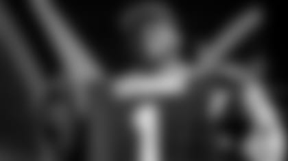 North Carolina State offensive tackle Ikem Ekwonu poses for photos after being picked by the Carolina Panthers with the sixth pick of the NFL football draft Thursday, April 28, 2022, in Las Vegas. (AP Photo/John Locher)