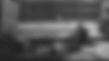 Kliff Kingsbury in his office watching video Gradient