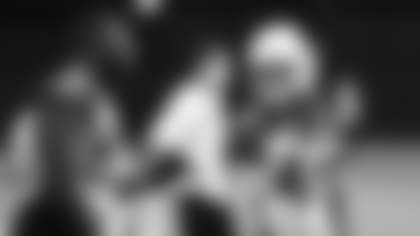 OLB Chandller Jones (left) and ILB Dennis Gardeck talk during Wednesday's practice.