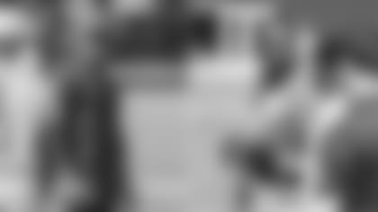 Cardinals defensive coordinator Vance Joseph (left) and vice president of player personnel Quentin Harris at recent workouts.