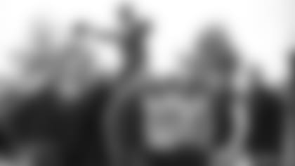 From left, GM Monti Ossenfort, OC Drew Petzing, QB coach Israel Woolfork, head coach Jonathan Gannon, Kyler Murray, offensive quality control coach Connor Senger, senior vice president of media relations Mark Dalton and senior director of media relations Chris Melvin.