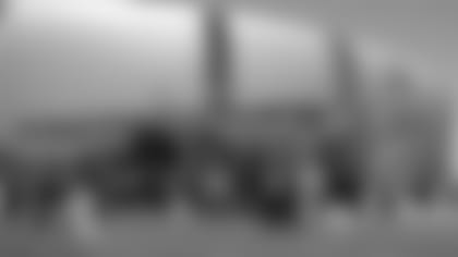 Fans buy food at the barbecue Saturday prior to the Red and White practice, with all proceeds benefiting the 100 Club of Arizona.